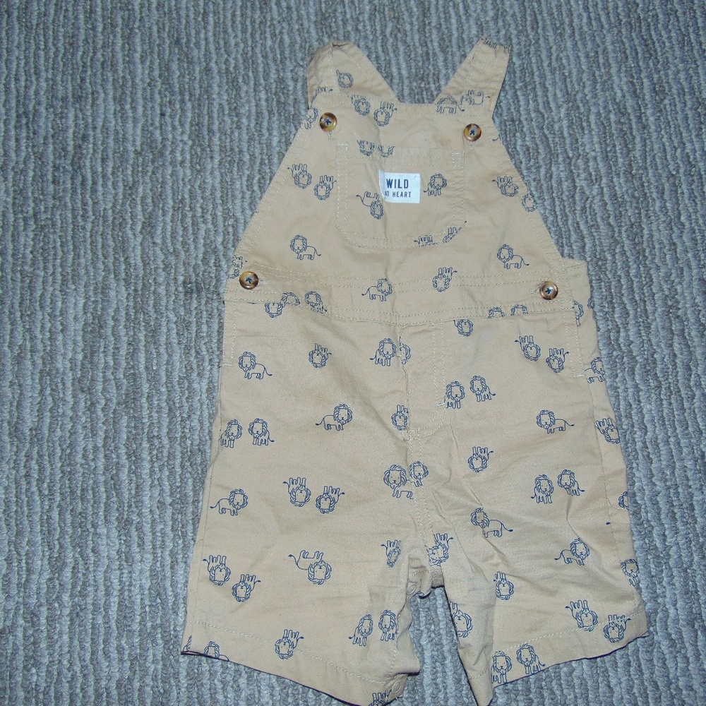 Baby overall with lion patterns